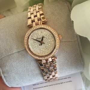 Michael Kors women’s petite darci rose gold watch